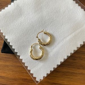 Gold huggie 10k earring